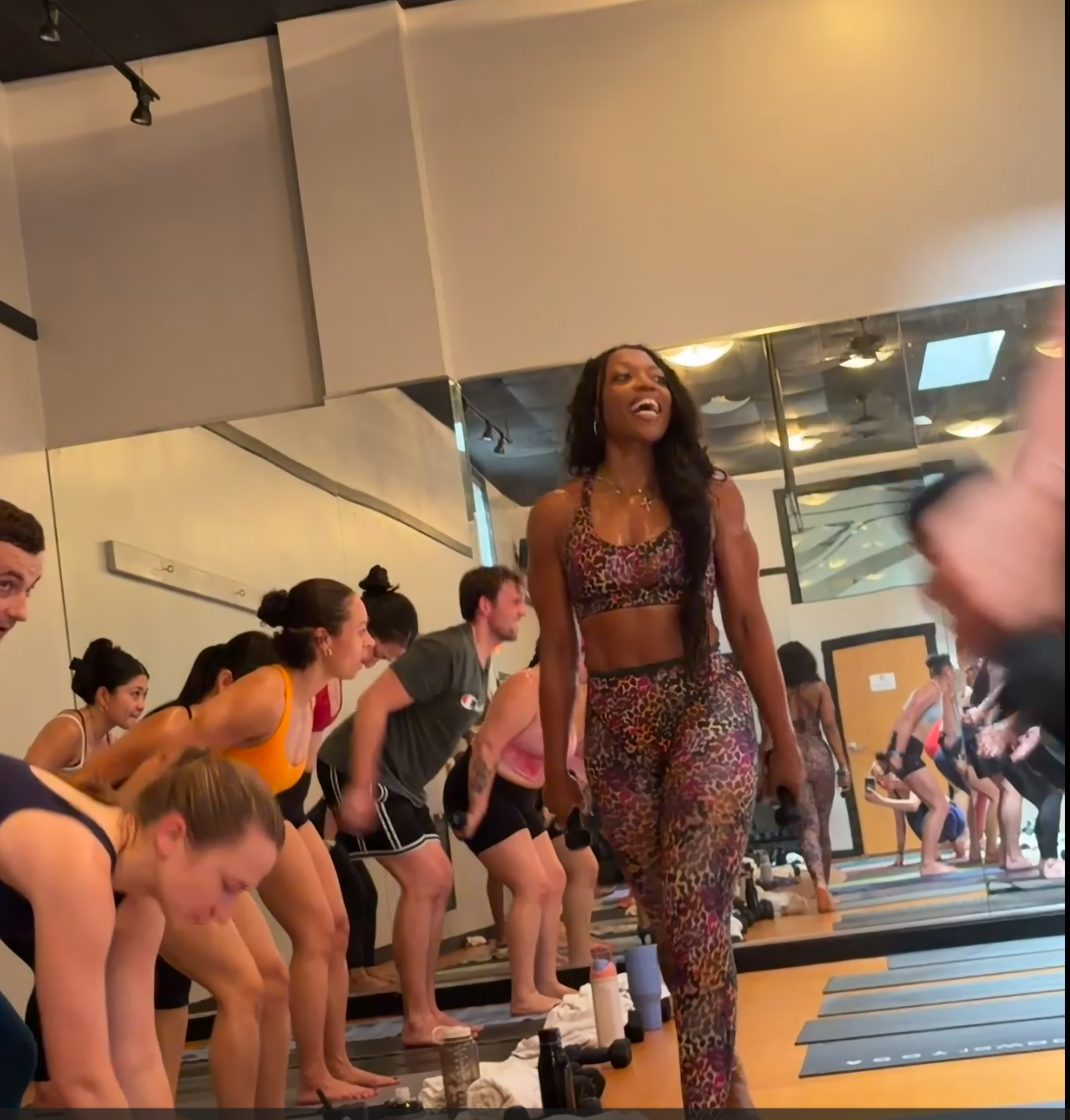 Danika James-Brayboy teaching a Yoga Sculpt class with weights
